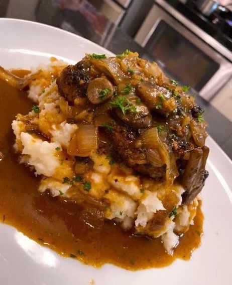 STEAK WITH MASHED POTATOES AND MUSHROOM GRAVY