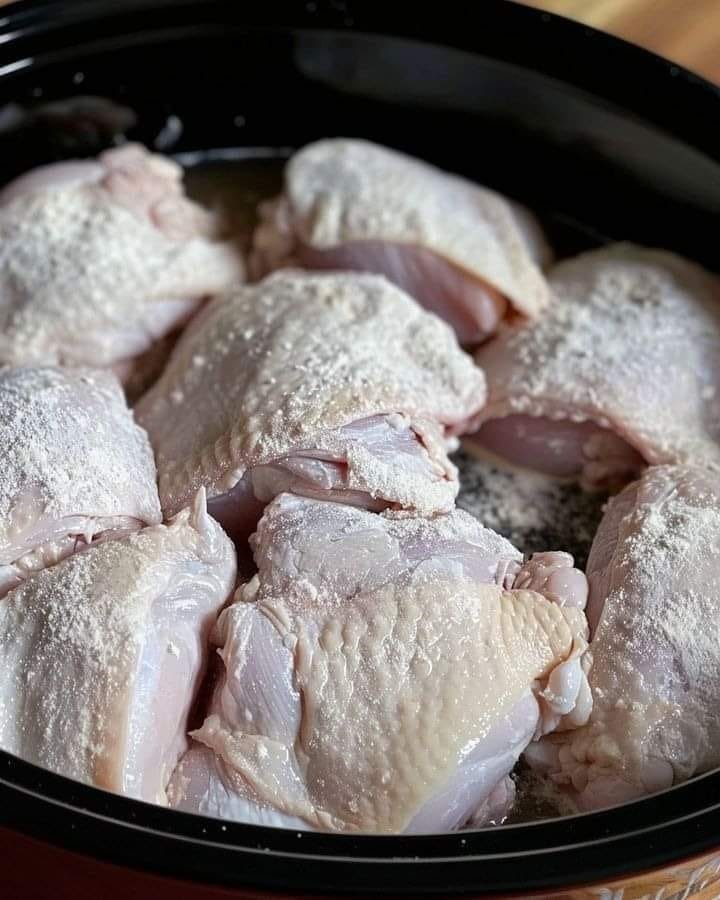 Coat chicken in flour and toss in slow cooker. With only 4 more ingredients, get a terrific dinner