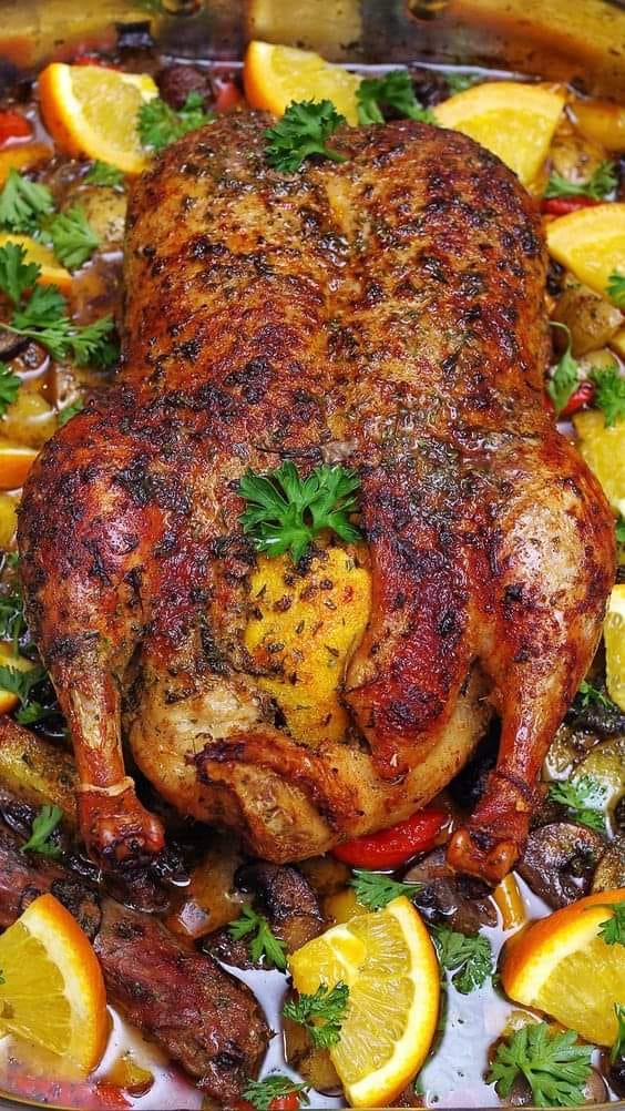 ROASTED DUCK IN WINE WITH POTATOES, PEPPERS AND MUSHROOMS